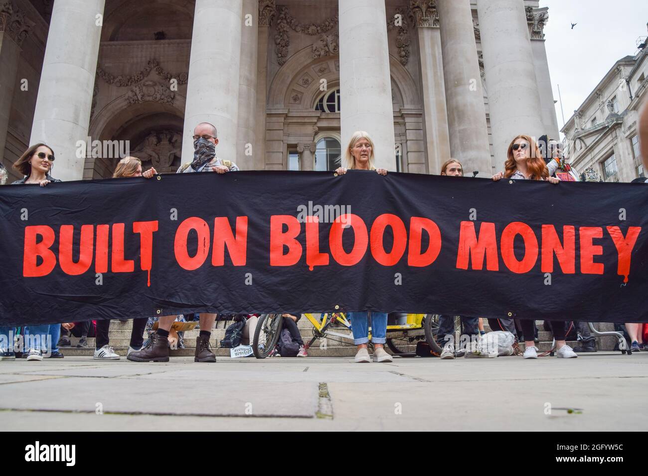 London, United Kingdom. 27th August 2021. Extinction Rebellion protesters outside The Royal Exchange, part of their Blood Money March targeting the City of London. (Credit: Vuk Valcic / Alamy Live News) Stock Photo