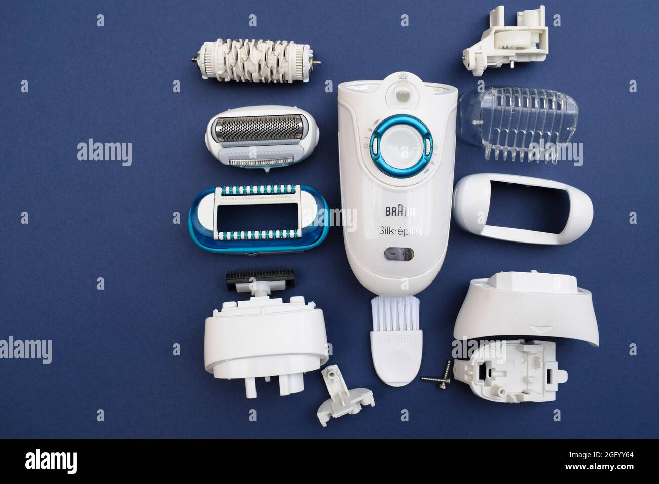 https://c8.alamy.com/comp/2GFYY64/braun-epilator-for-women-with-many-parts-it-is-opened-and-repaired-unscrewed-for-cleaning-purpose-many-parts-of-epilator-with-razor-combo-2GFYY64.jpg