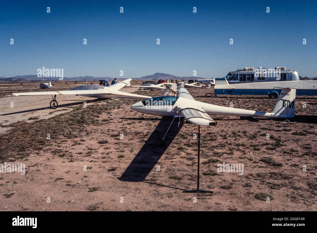 A group of gliders on the ground at a flyin in Marfa, Texas. In front