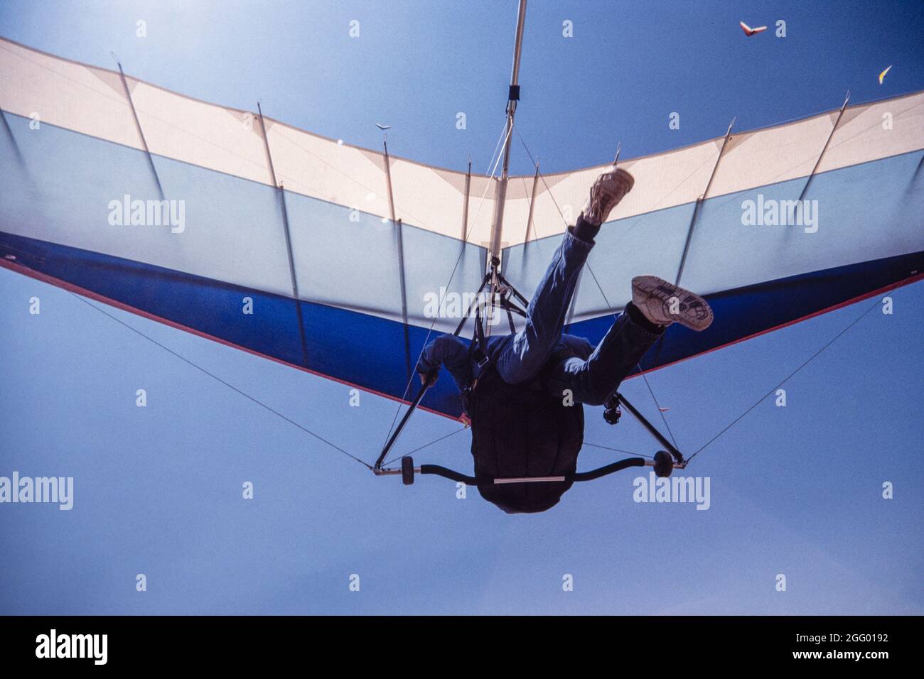 A hang glider pilot takes off from the launch ramp on Horse Ridge at