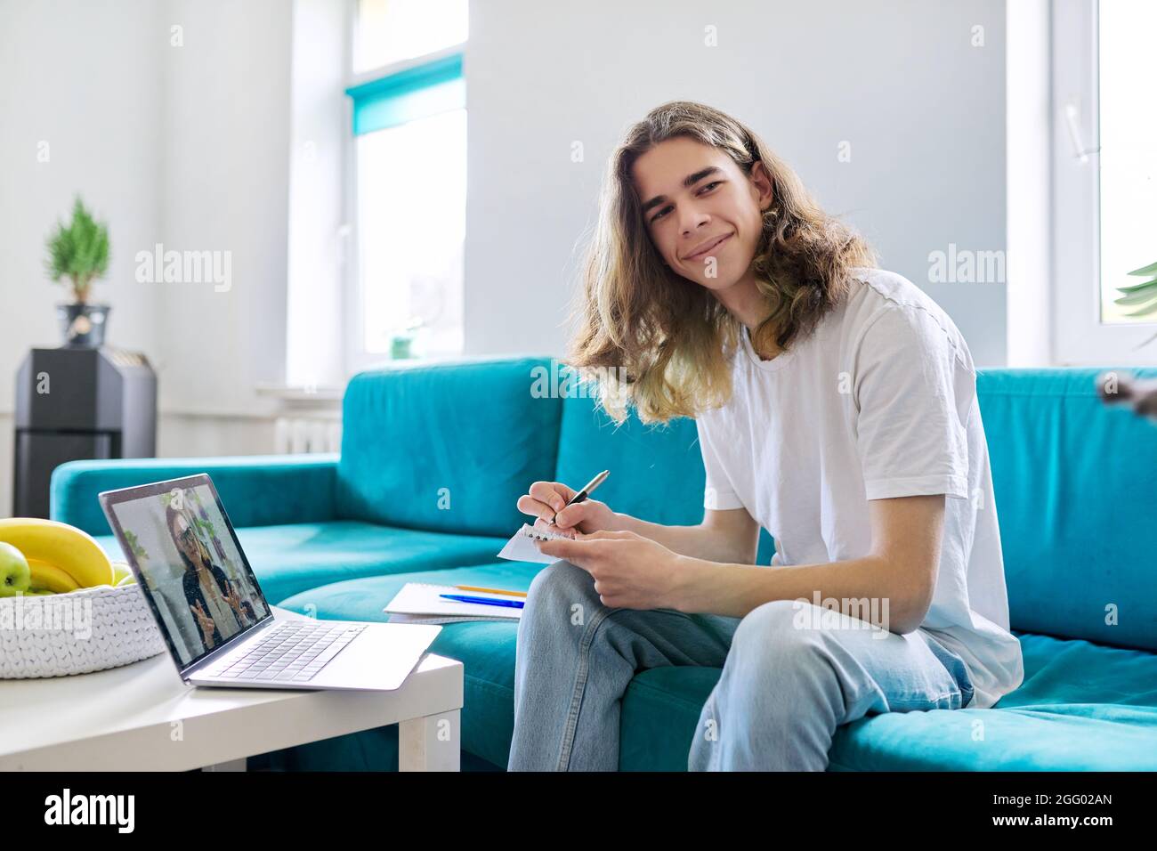 Individual online lesson, teenage boy studying at home with laptop ...