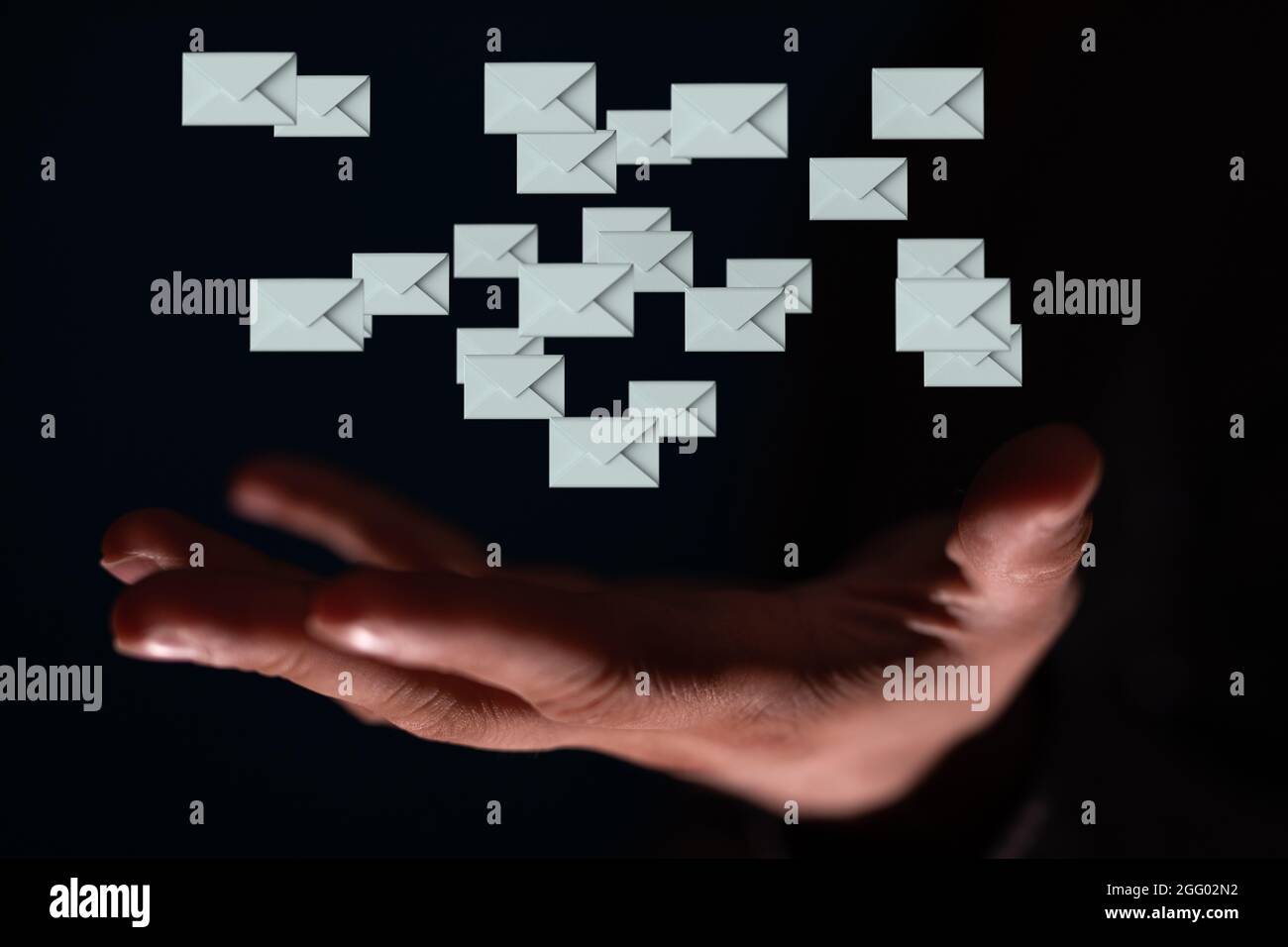 Holding message icons - the concept of email marketing Stock Photo - Alamy