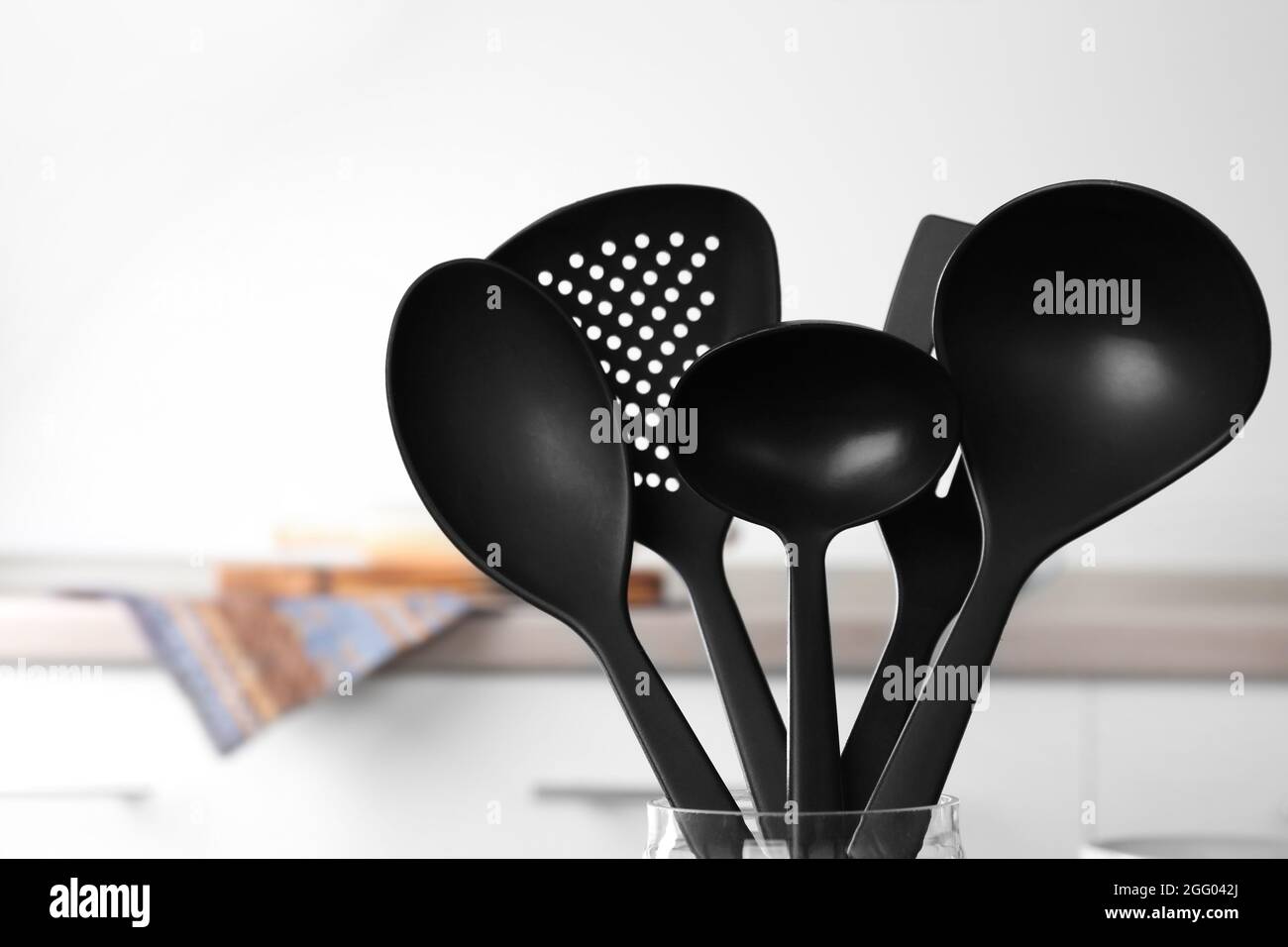 Black cooking utensils at kitchen Stock Photo Alamy