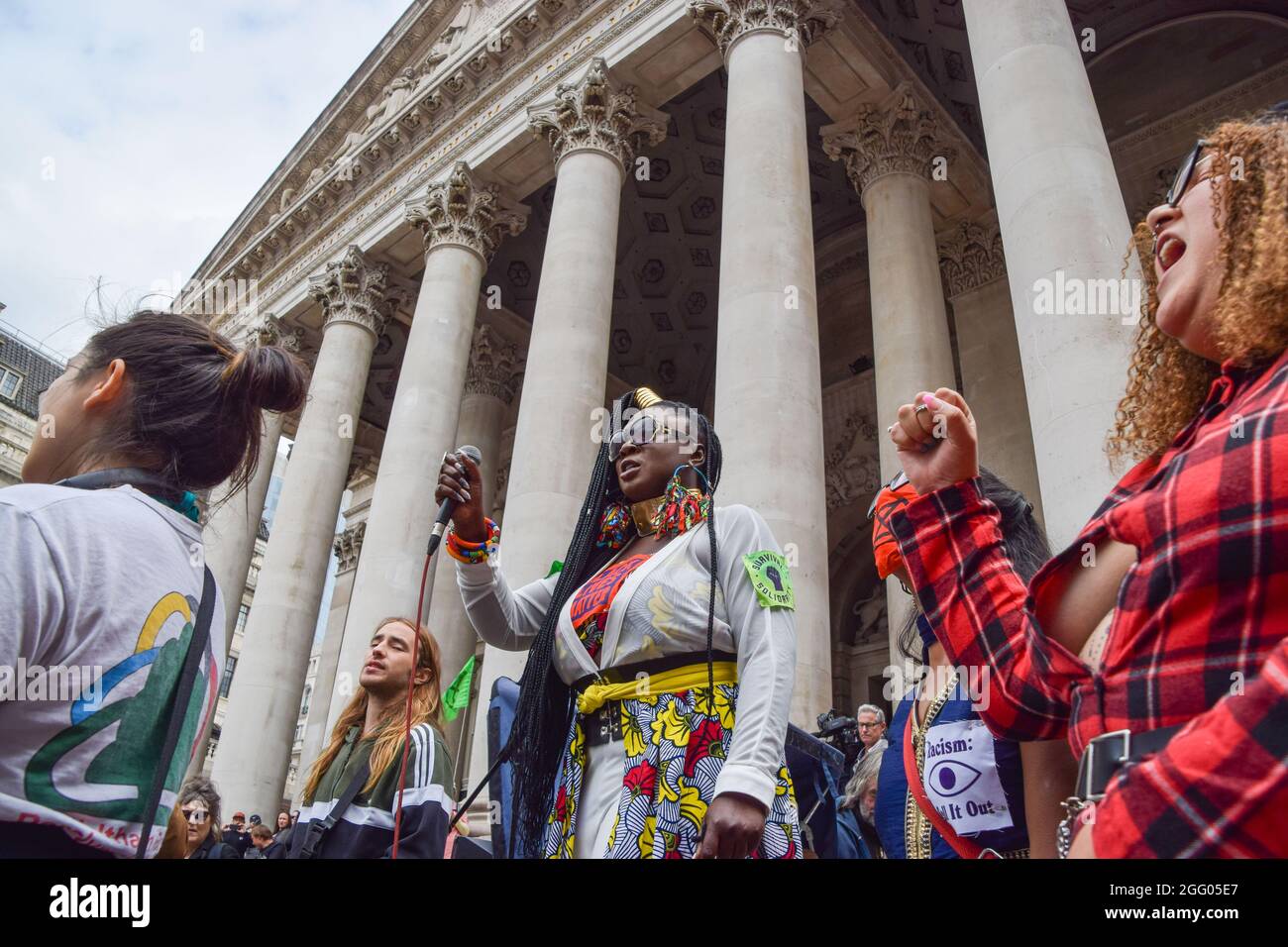 London, United Kingdom. 27th August 2021. Activist Marvina Newton speaks to Extinction Rebellion protesters outside The Royal Exchange, part of their Blood Money March targeting the City of London. (Credit: Vuk Valcic / Alamy Live News) Stock Photo