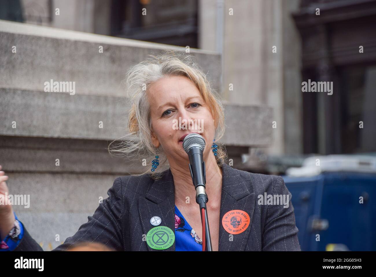 London, United Kingdom. 27th August 2021. Extinction Rebellion co-founder Gail Bradbrook speaks to protesters outside The Royal Exchange, part of their Blood Money March targeting the City of London. (Credit: Vuk Valcic / Alamy Live News) Stock Photo