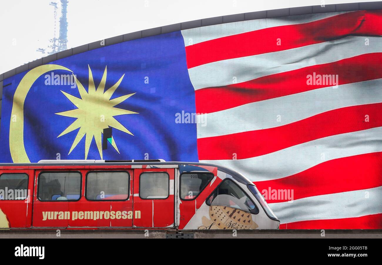 A Light Rail Transit Train Moves Past A Digital Billboard With A Malaysian National Flag Malaysia Will Be Celebrating The 64th Independence Day Also Known As National Day Or Hari Merdeka In Malay Annually On August 31 It Commemorates The Malayan