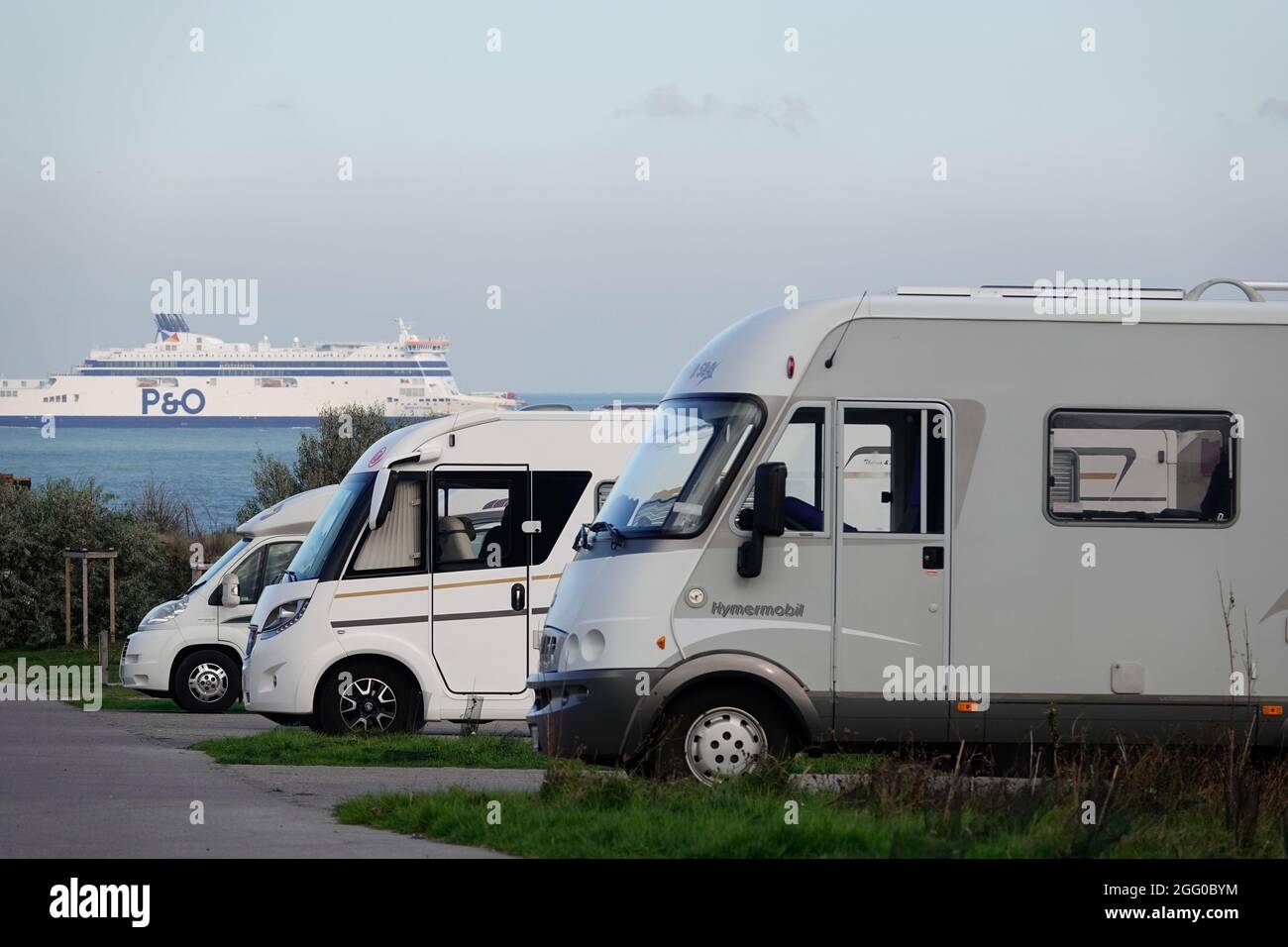 Motorhomes parked in a French Aire (motorhome parking for staying overnight) at Sangatte, Calais, France. The aire overlooks the Enlish channel. Stock Photo