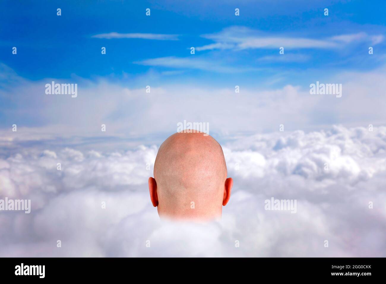 Head in the clouds, conceptual composite image. Stock Photo