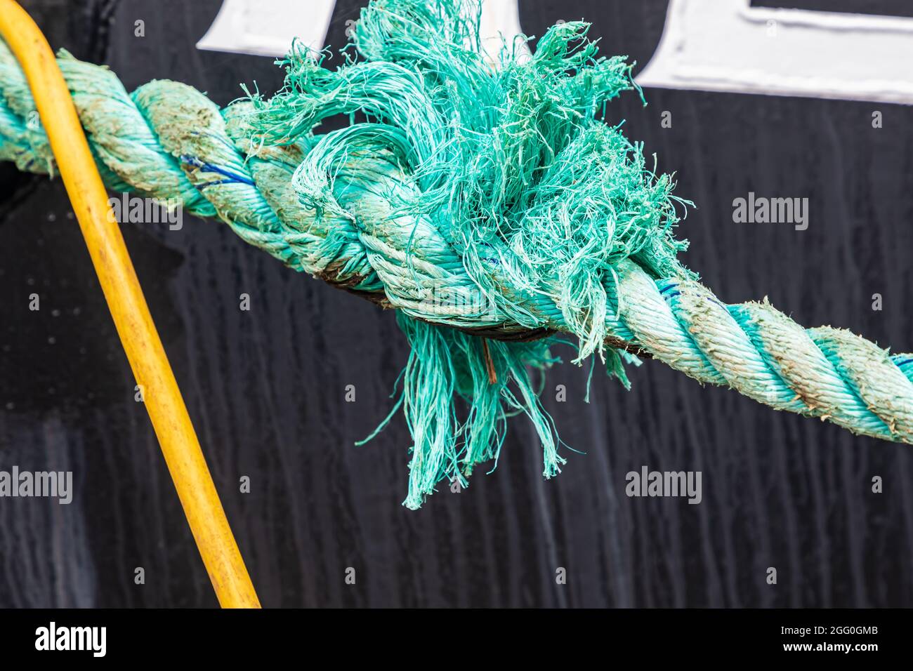 Coos Bay, Oregon, USA. Frayed splice on a rope tied to a fishing boat. Stock Photo