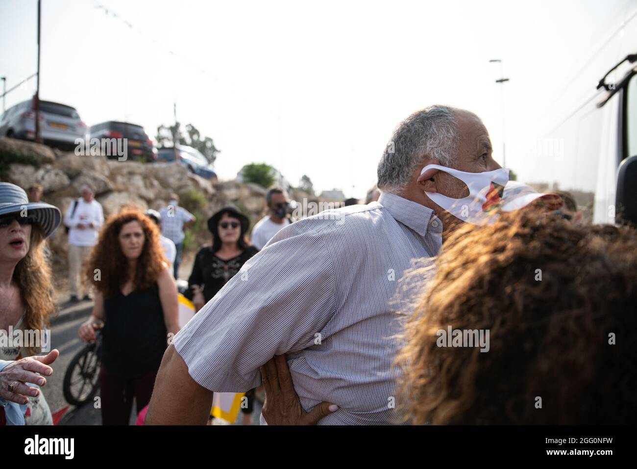 Jewish and Palestinian protestors in Sheikh Jarach during the weekly protest in front of the Israeli Police checkpoint at the entrance to the neigberhood - which is monitoring entrance of non-residents since last April. Sheikh Jarach. Jerusalem, Israel. 28th Aug 2021. (Photo by Matan Golan/Alamy Live News) Stock Photo