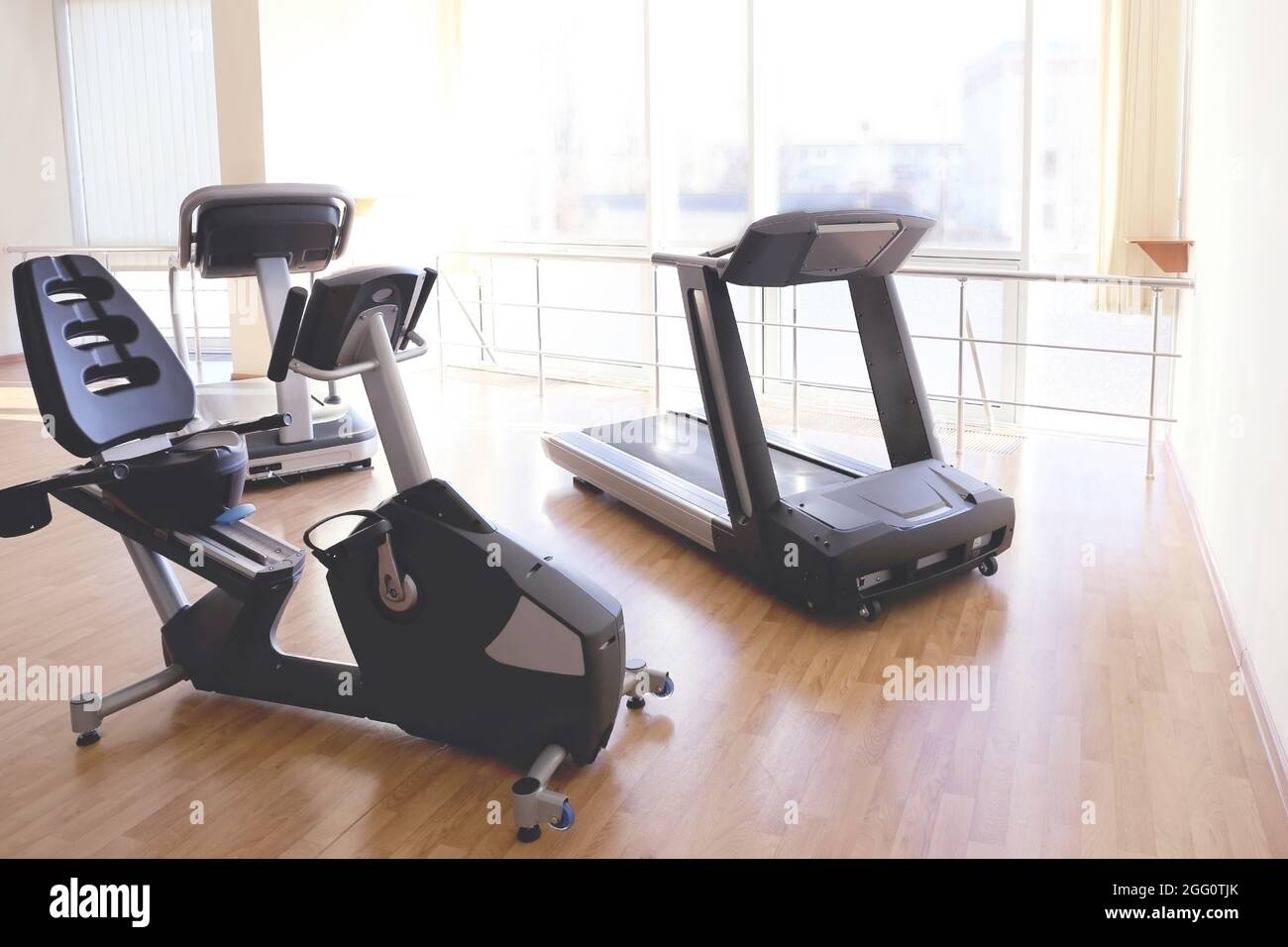 Exercise bike and treadmill in gym Stock Photo Alamy