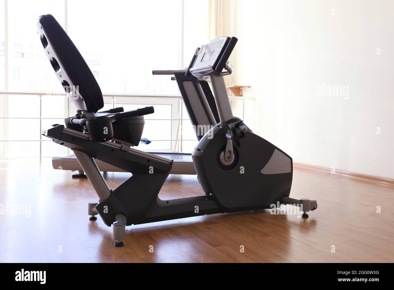 Exercise bike and treadmill in gym Stock Photo Alamy