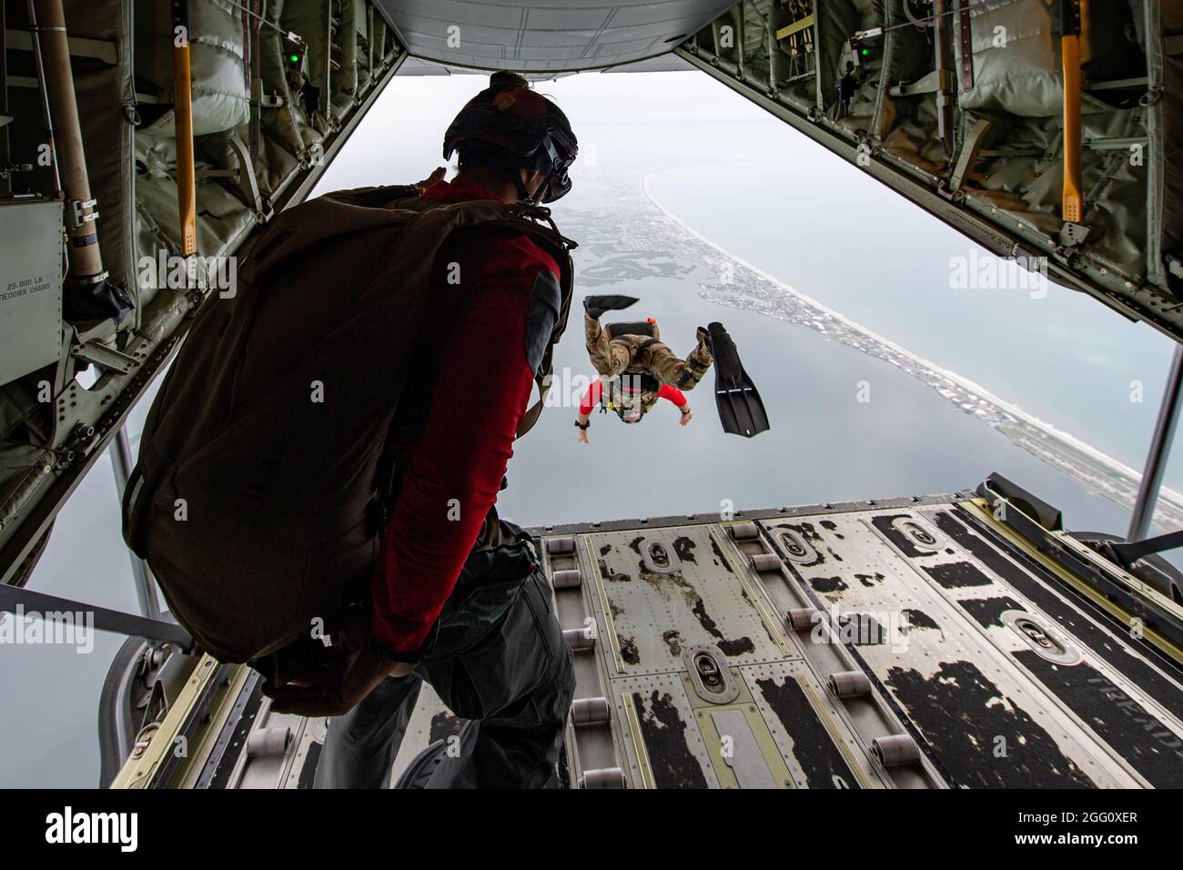 U.S. Air Force pararescuemen assigned to the 38th Rescue Squadron jump ...