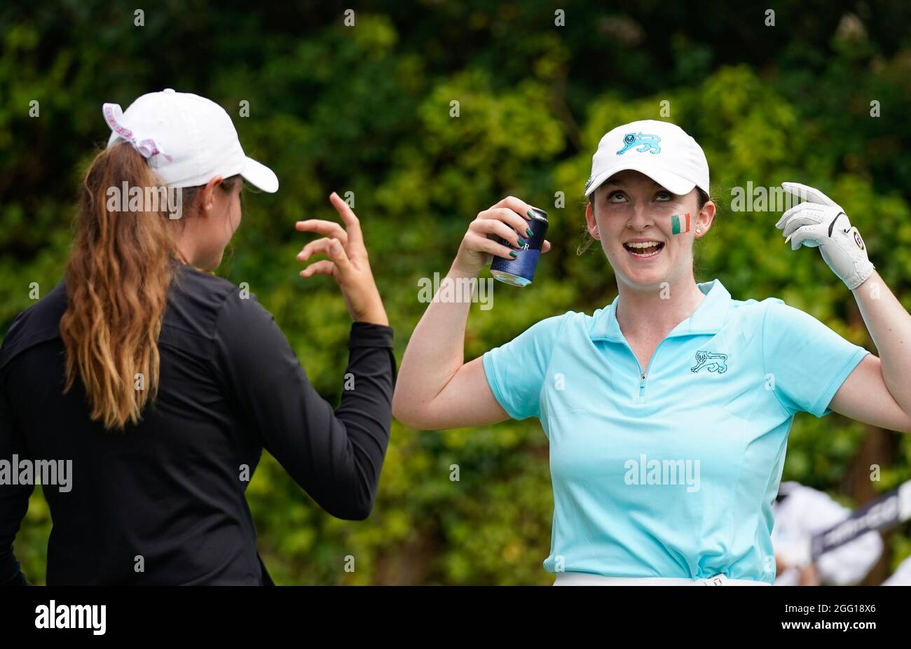 Team GB&I's Caley McGinty shares awoke with Lauren Walsh while they wait on the 7th tee during the 2021 Curtis Cup Day 1 - Afternoon Fourballs at Conw Stock Photo