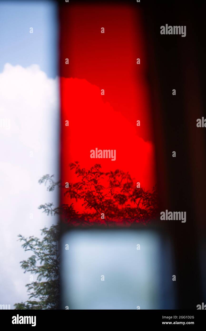 Sky and trees through a stained glass window Stock Photo