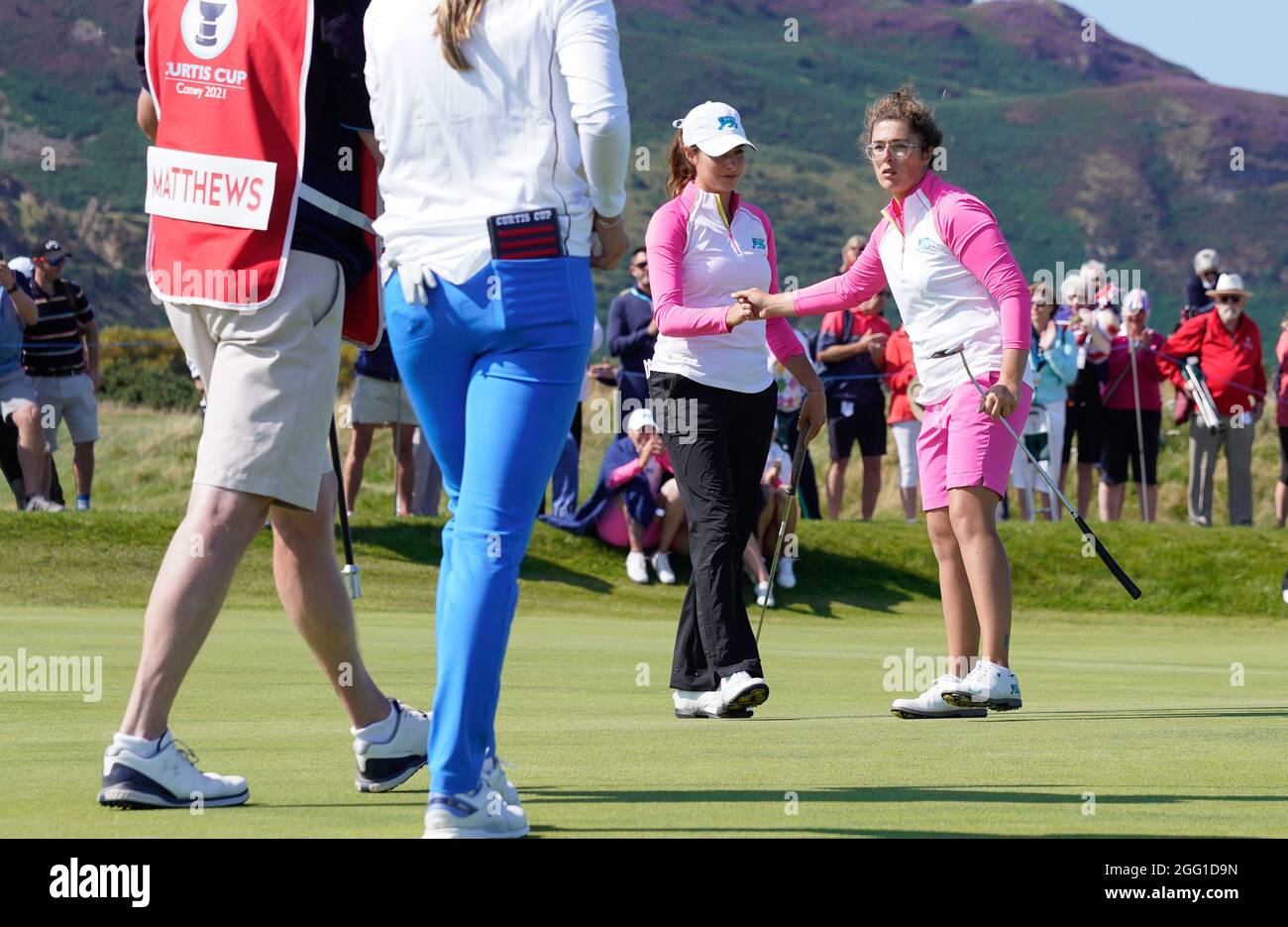 Team GB&I's Emily Toy fist pumps with Caley McGinty after halving their match against Team USA's Jensen Castle and Brooke Matthews during the 2021 Cur Stock Photo