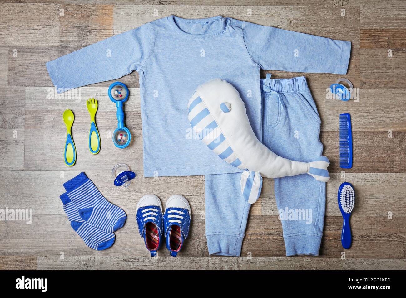 Baby clothes and accessories on wooden background Stock Photo Alamy