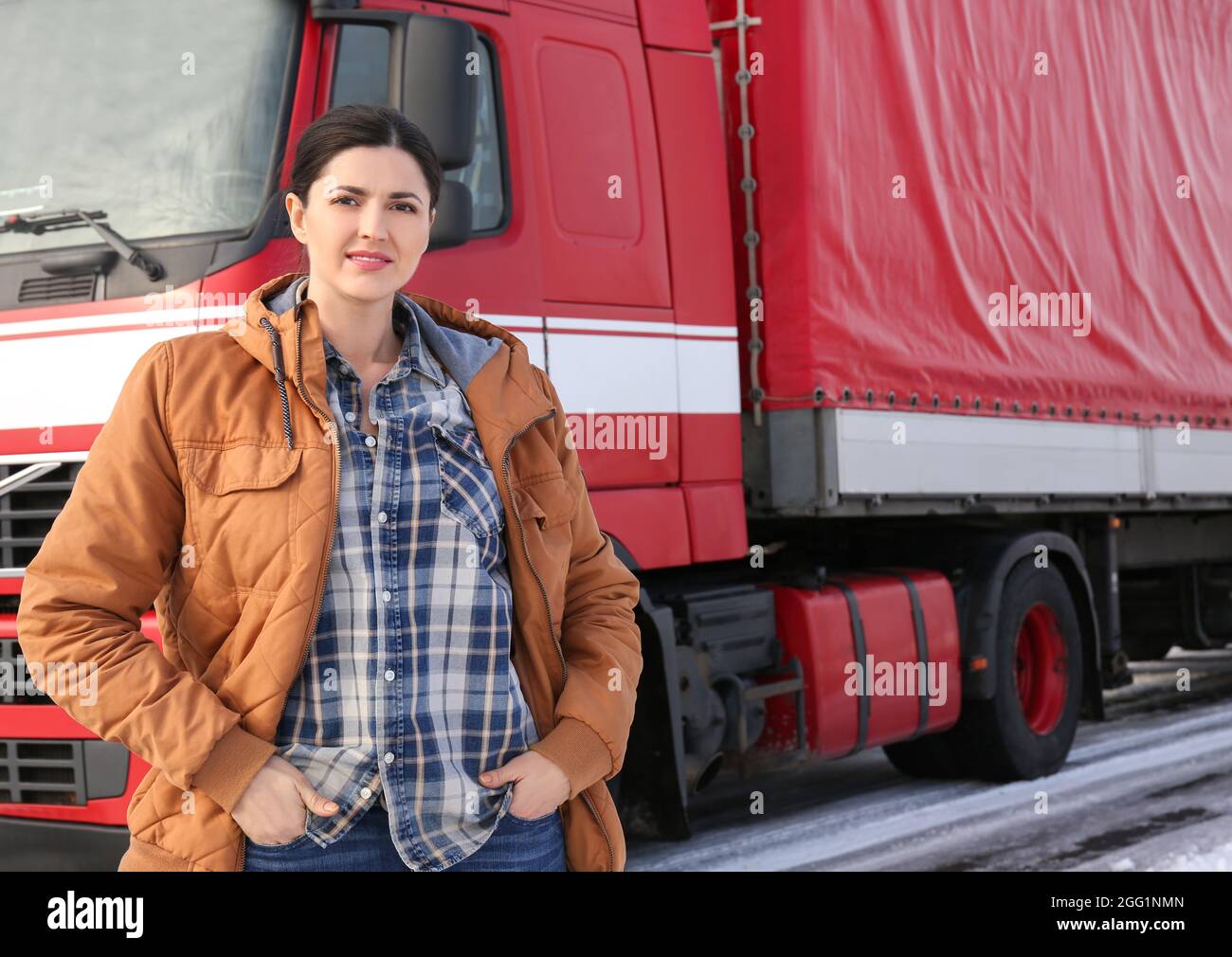 Female driver near big modern truck outdoors Stock Photo - Alamy