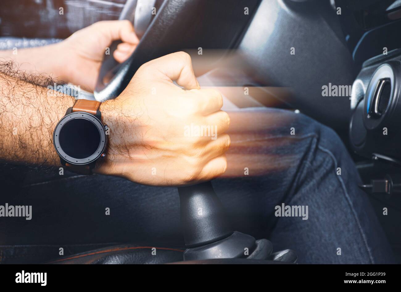 The driver controls the gear lever of manual transmission in the car