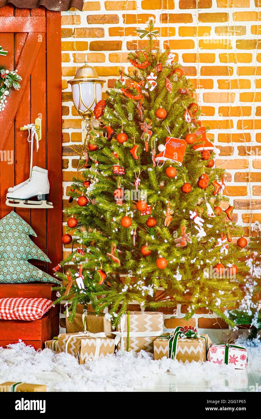 2022. Christmas Tree With Christmas Toys: Wooden Sleigh, Small Bird, Cones, Balls, Colored Lights.concept: New Year, Christmas, Greeting Card, Celebra Stock Photo - Alamy
