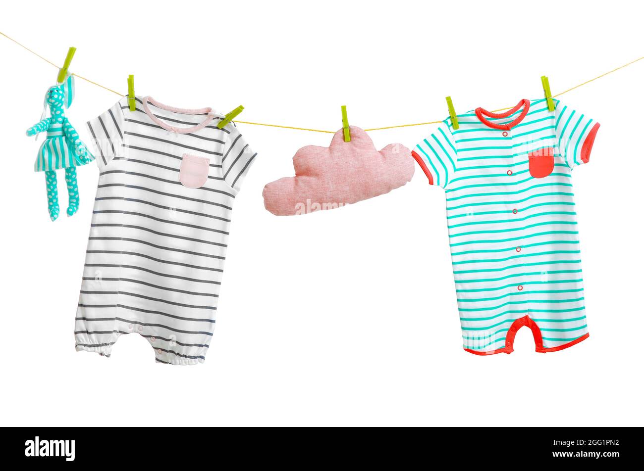 Baby clothes hanging on white background Stock Photo Alamy