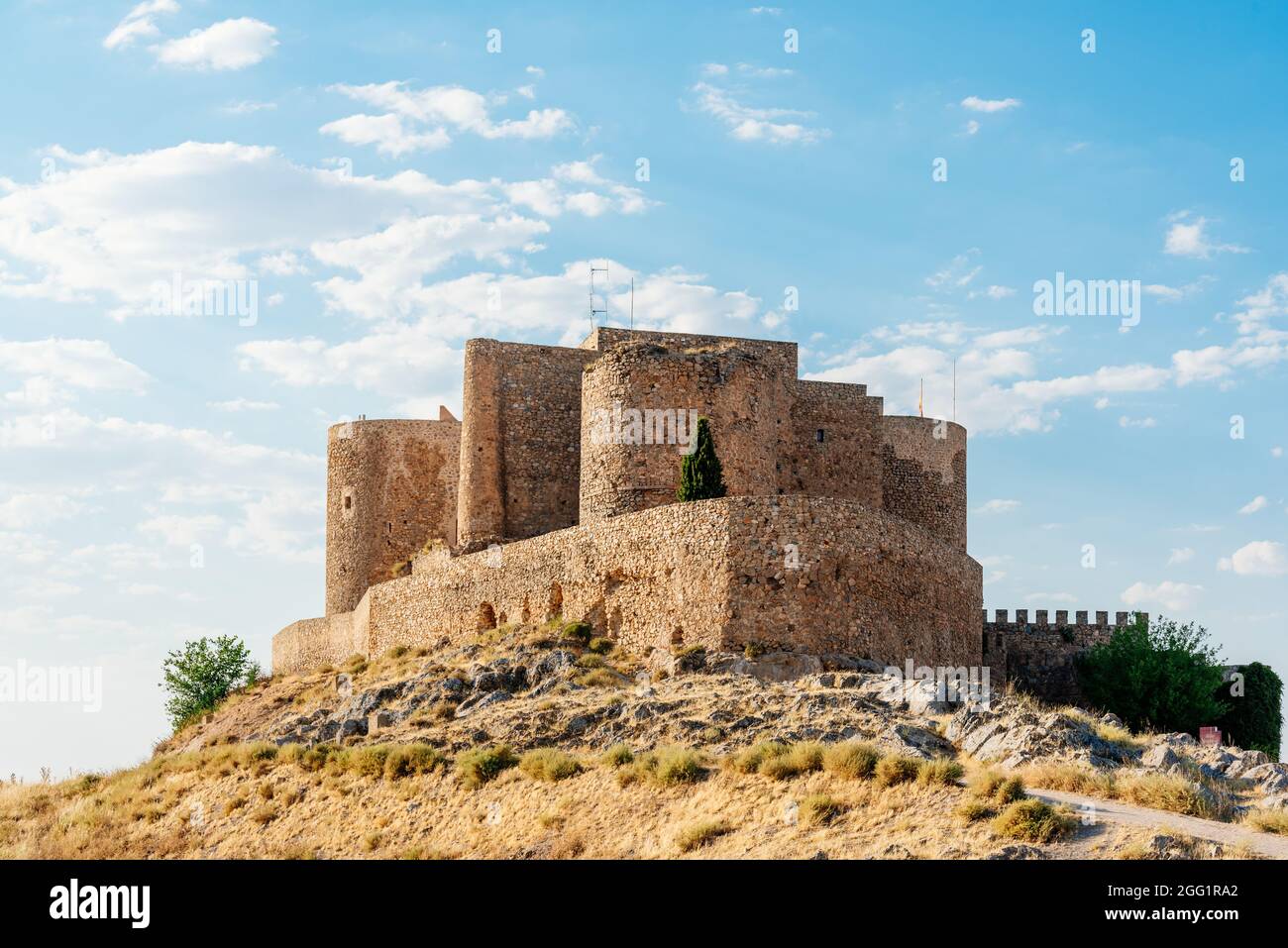 Restored medieval castle and walls on a hill Stock Photo - Alamy