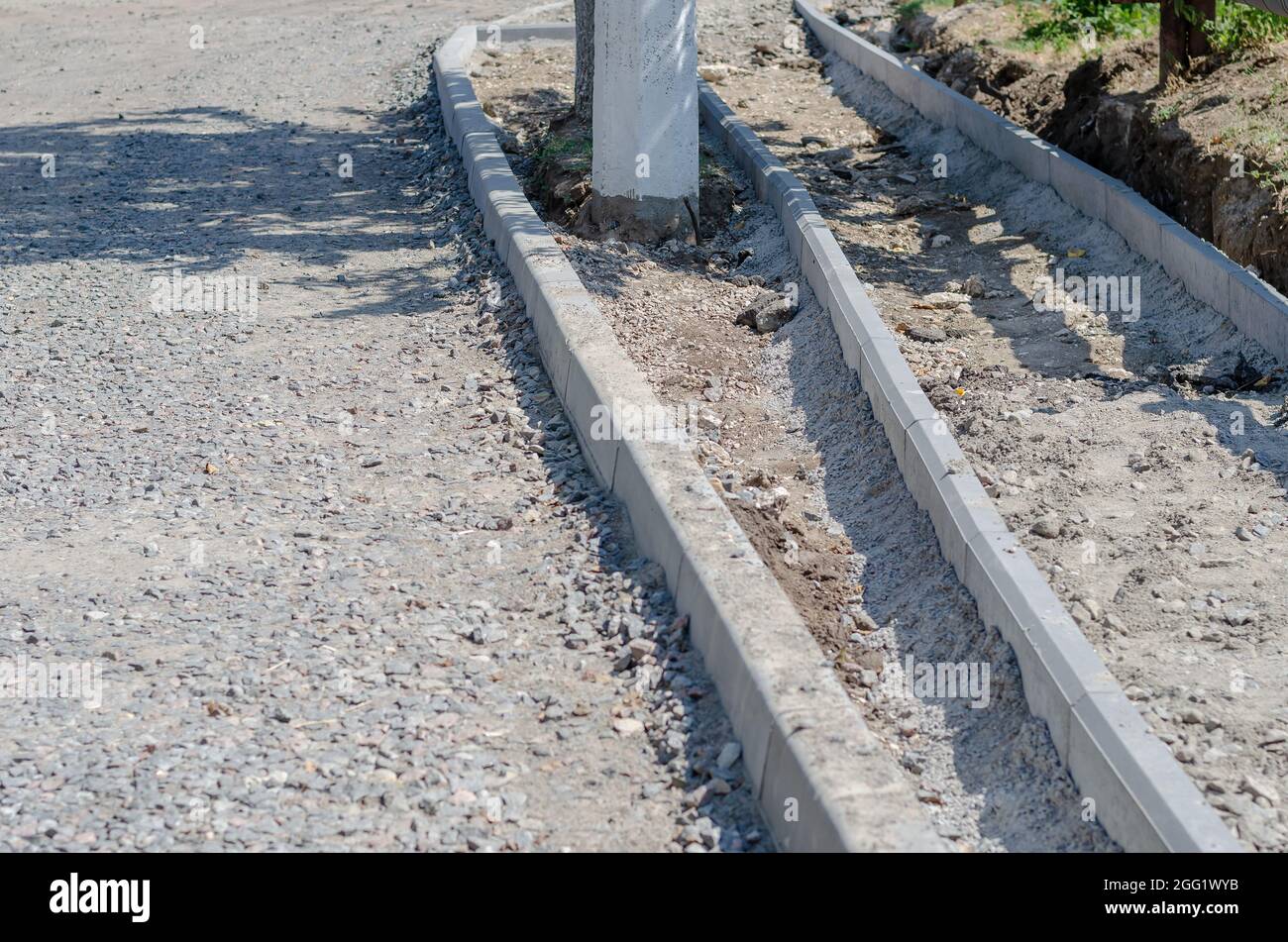 Construction of a new road, sidewalk, storm drainage. Pedestrian ...