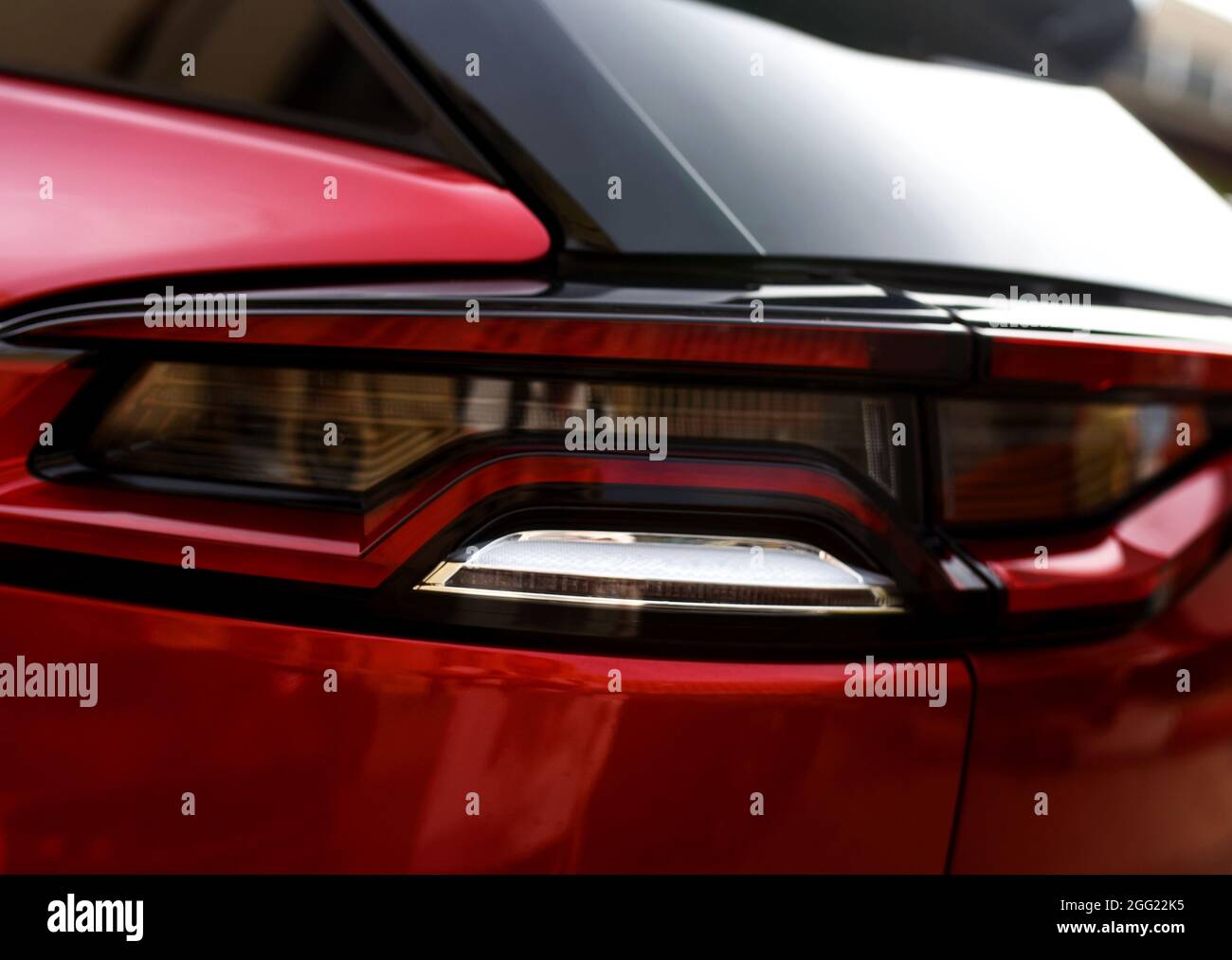 Rear LED headlamp of a modern car. Brake taillight. Red stop lighting
