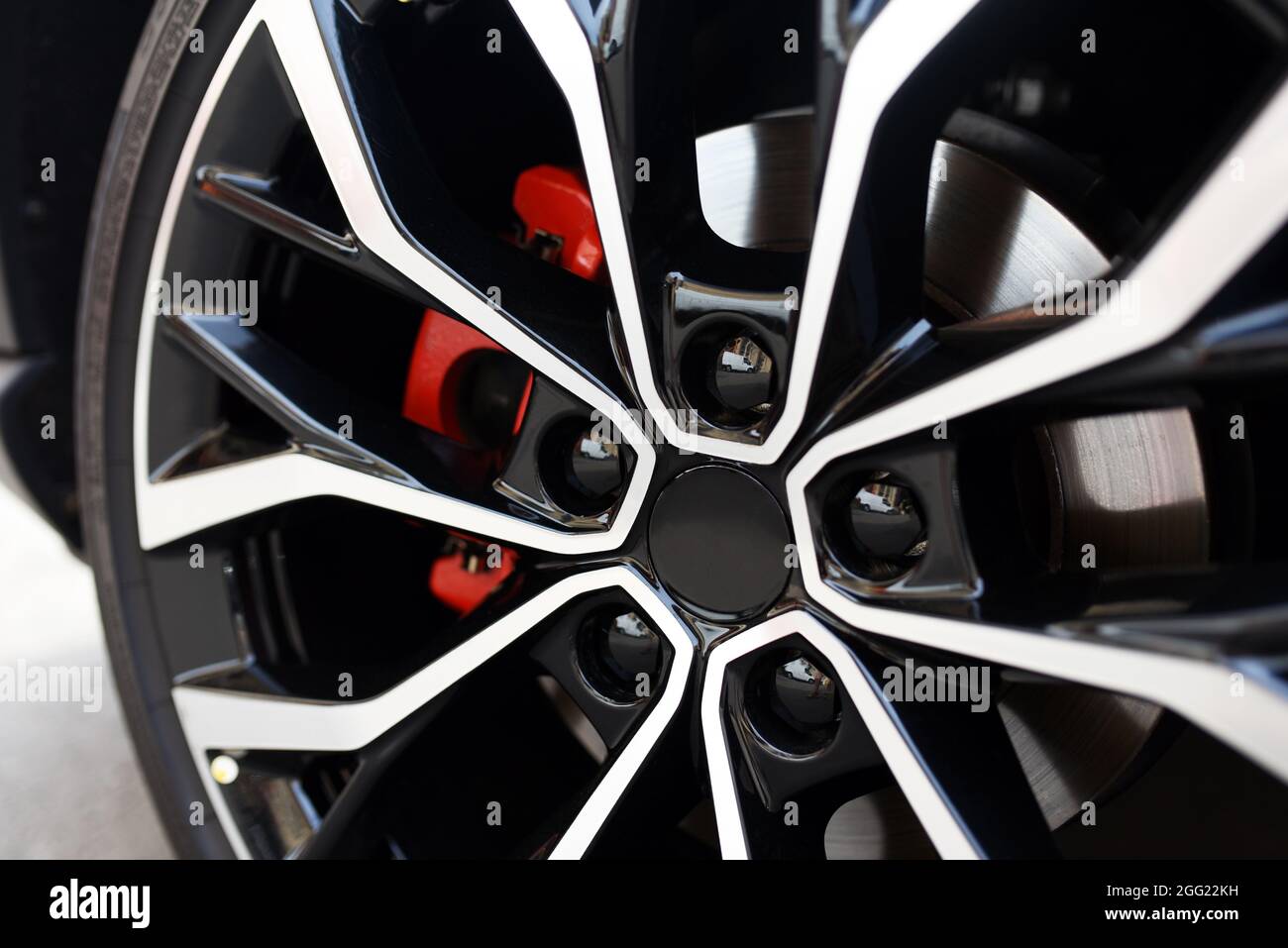 Sports car alloy wheel with red calipers and brakes. Racing brake disc and  low profile tyres. Car Shopping and Test Driving. Lower-profile tires are a  Stock Photo - Alamy