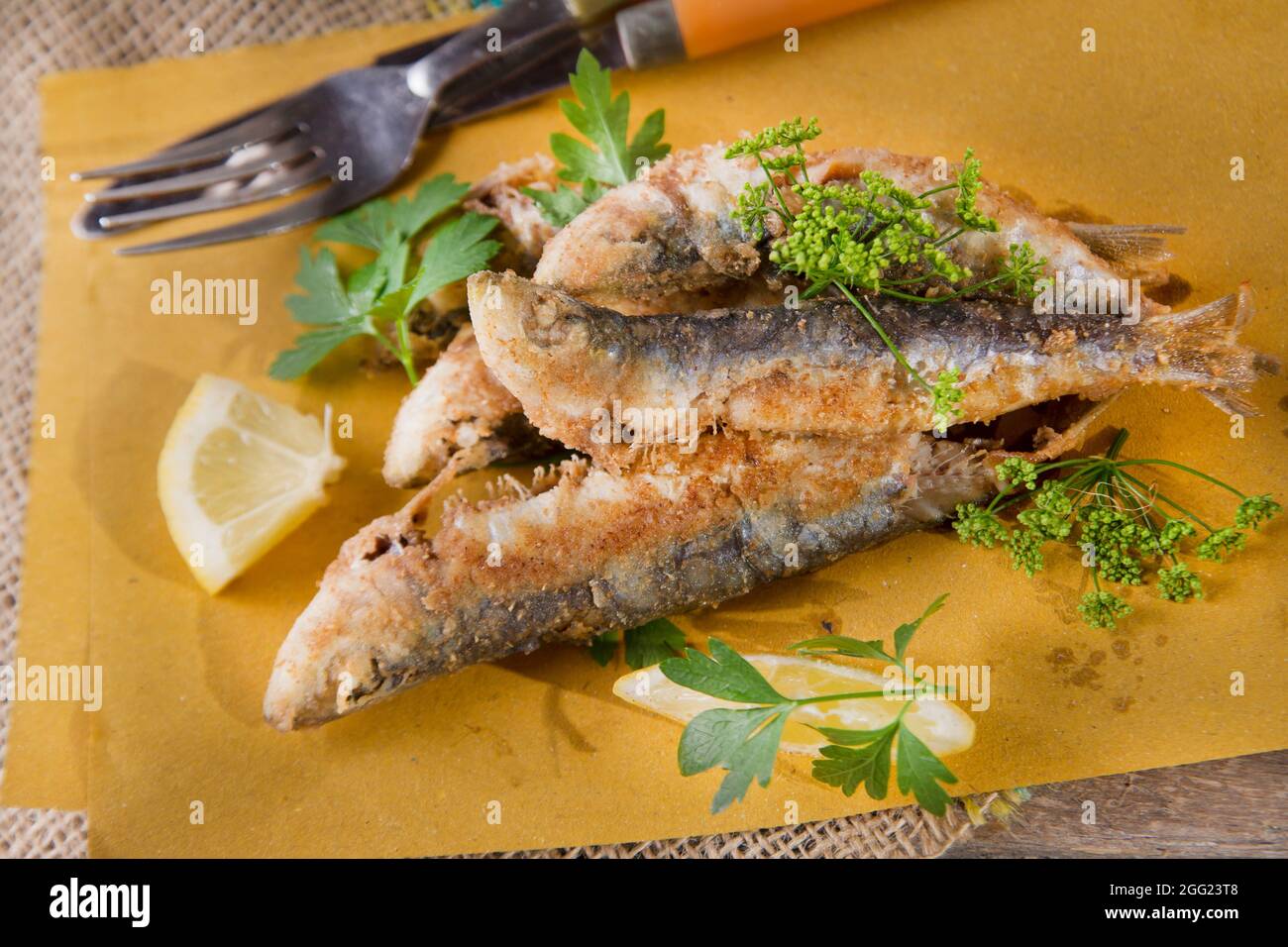 Presentation of a seafood platter, fried anchovies Stock Photo Alamy