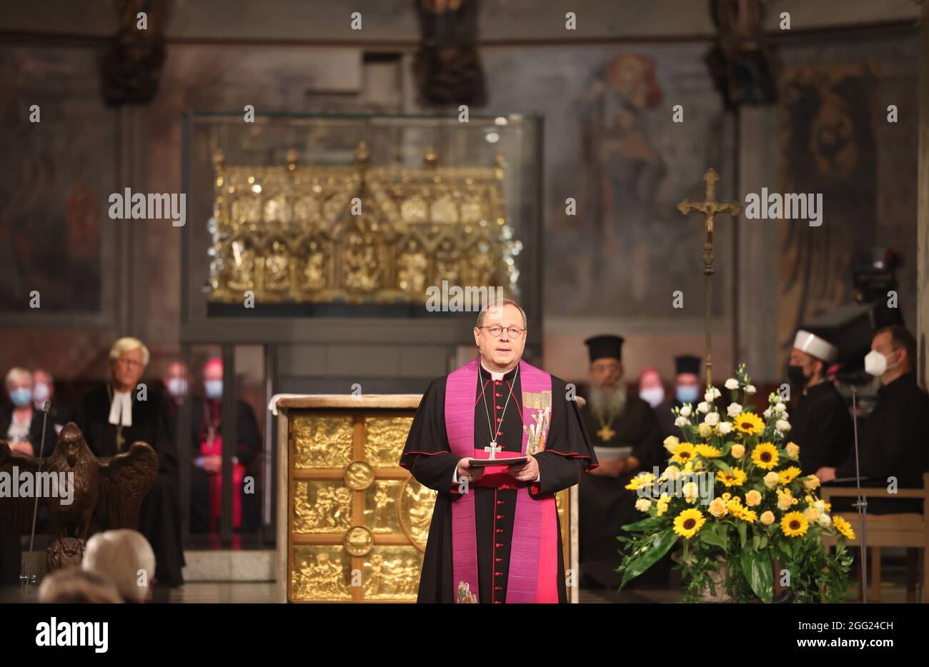 Aachen, Germany. 28th Aug, 2021. Georg Bätzing, chairman of the German Bishops' Conference, speaks at an ecumenical service for the victims of the flood disaster in western Germany in the cathedral. Credit: Oliver Berg/dpa-Pool/dpa/Alamy Live News Stock Photo