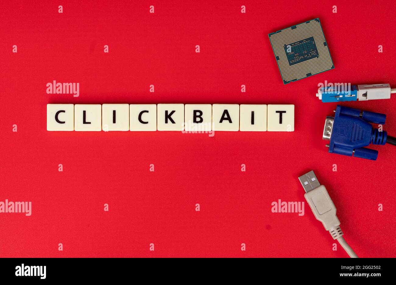 Cable heads, chip and tiles with text Clickbait. Clickbait is a method to entice user to click a post in the internet Stock Photo