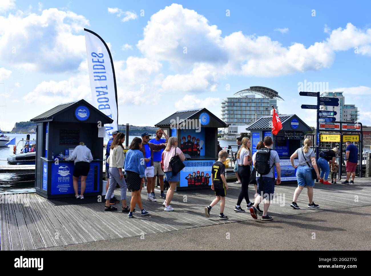 People walking along the boardwalk, Mermaid Quay, Cardiff Bay, Cardiff