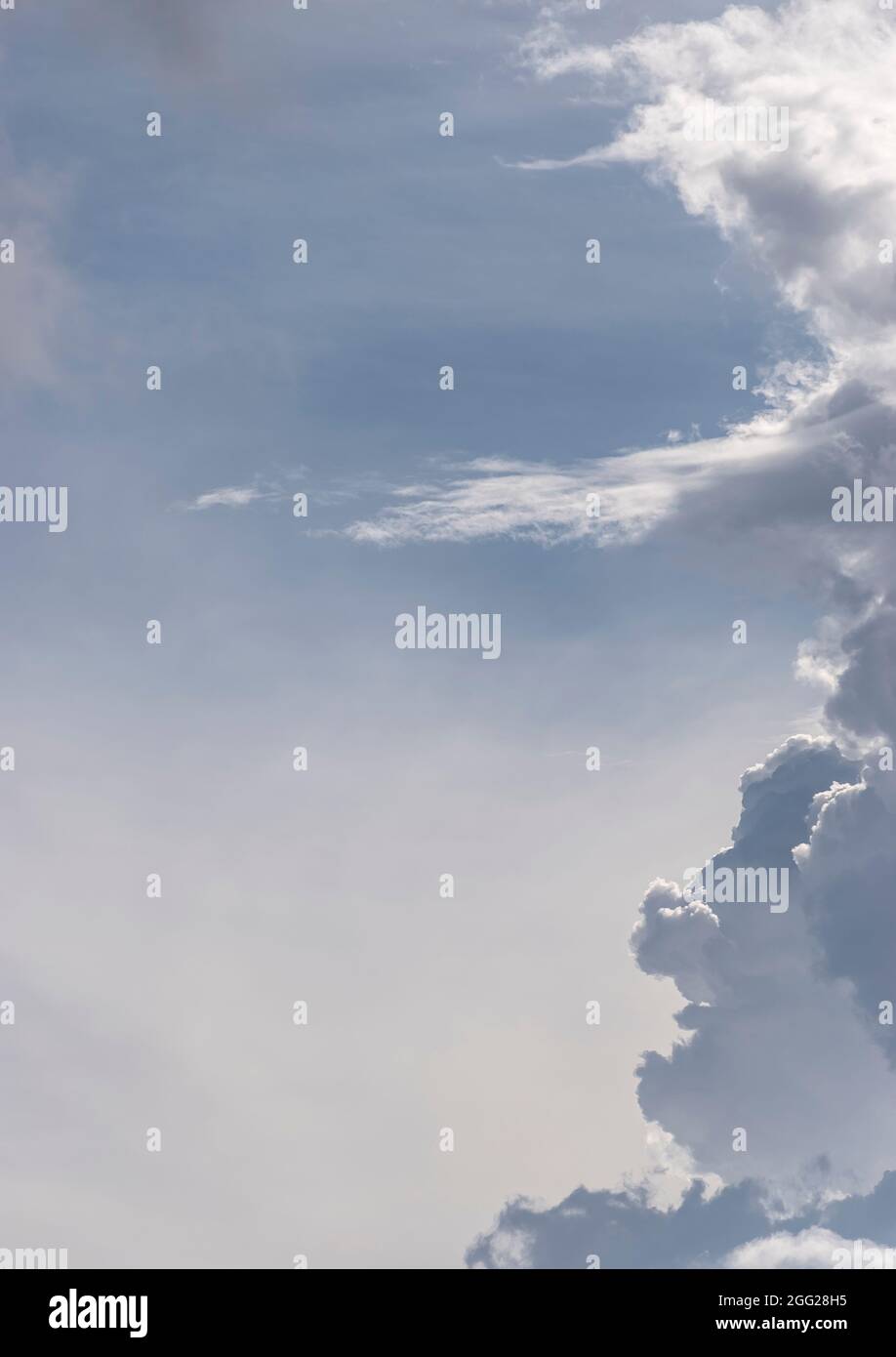 Evening sky with low sunlight and vertical bank of grey and white clouds. Copy space, background, autumn, Queensland, Australia. Stock Photo