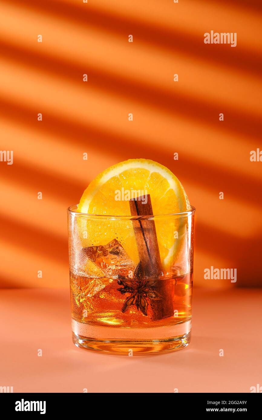 Sunny cocktail with brandy and orange liquor, cinnamon and star anise