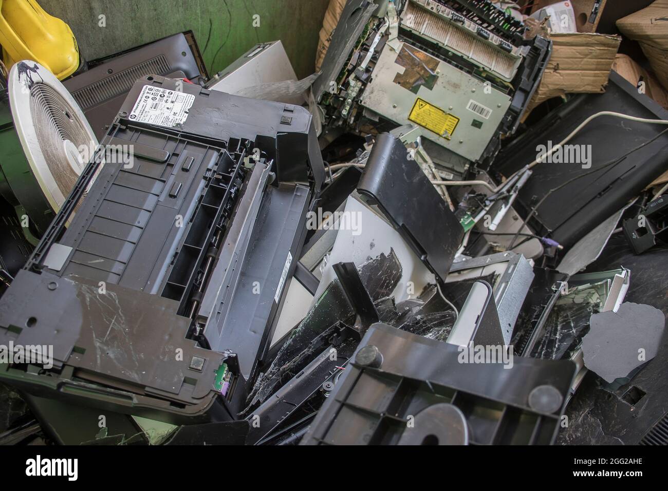 E-waste collected in skip at rural Australian recycling centre. Old computers, screens, and assorted electronic waste. Stock Photo