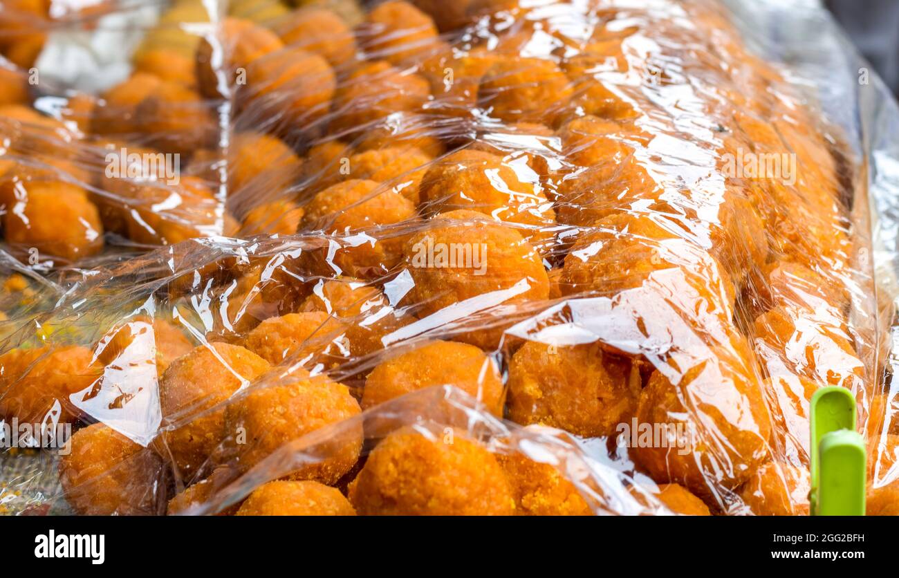 Indian dessert dry sweet rasgulla selling in the street close up Stock ...