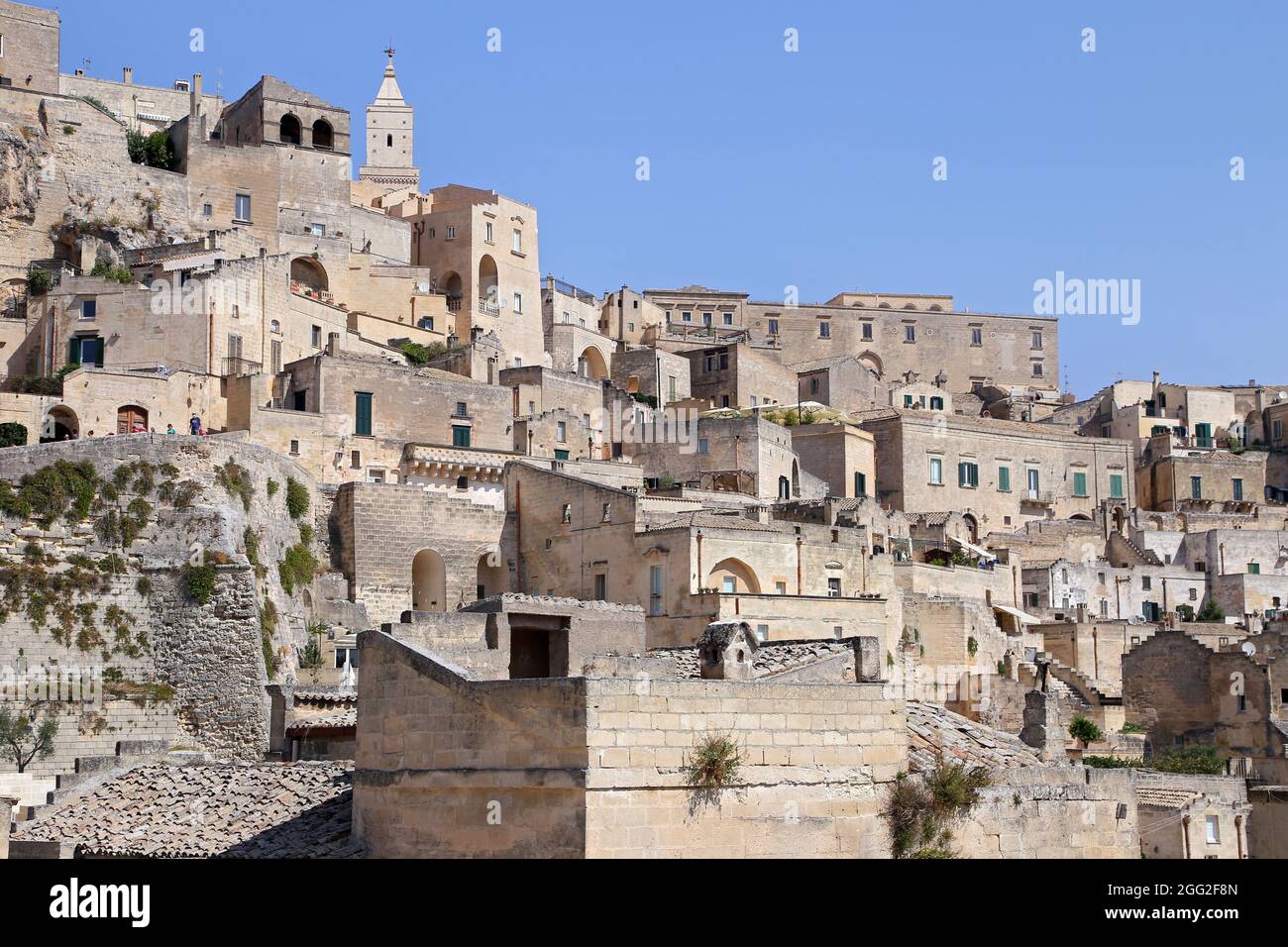 Matera, Italy - August 17, 2020: View of the Sassi di Matera a historic district in the city of Matera, well-known for their ancient cave dwellings. B Stock Photo