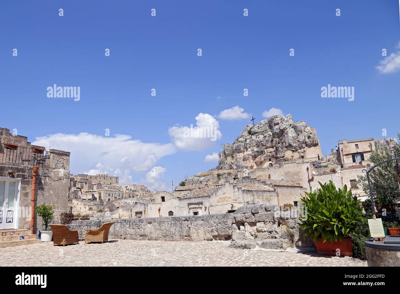 Matera, Italy - August 17, 2020: View of the Sassi di Matera a historic district in the city of Matera, well-known for their ancient cave dwellings. B Stock Photo