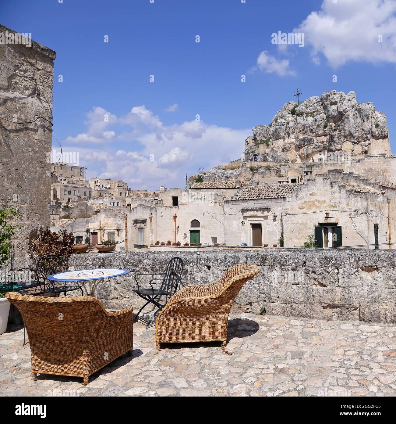 Matera, Italy - August 17, 2020: View of the Sassi di Matera a historic district in the city of Matera, well-known for their ancient cave dwellings. B Stock Photo