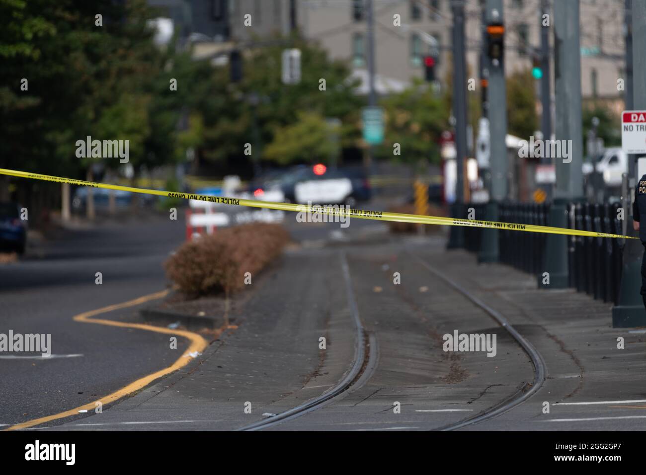 Portland, USA. 27th Aug, 2021. Crime scene tape is seen across a