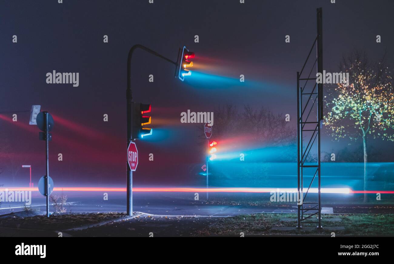 Street lights on the foggy street at night Stock Photo - Alamy