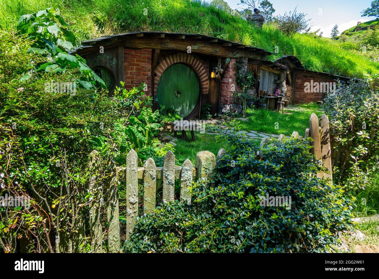 Green Door Hobbit Hole Home On The Hobbiton Movie Set For The Lord Of The Rings Movie Trilogy In Matamata New Zealand A Popular Tourist Attraction Stock Photo