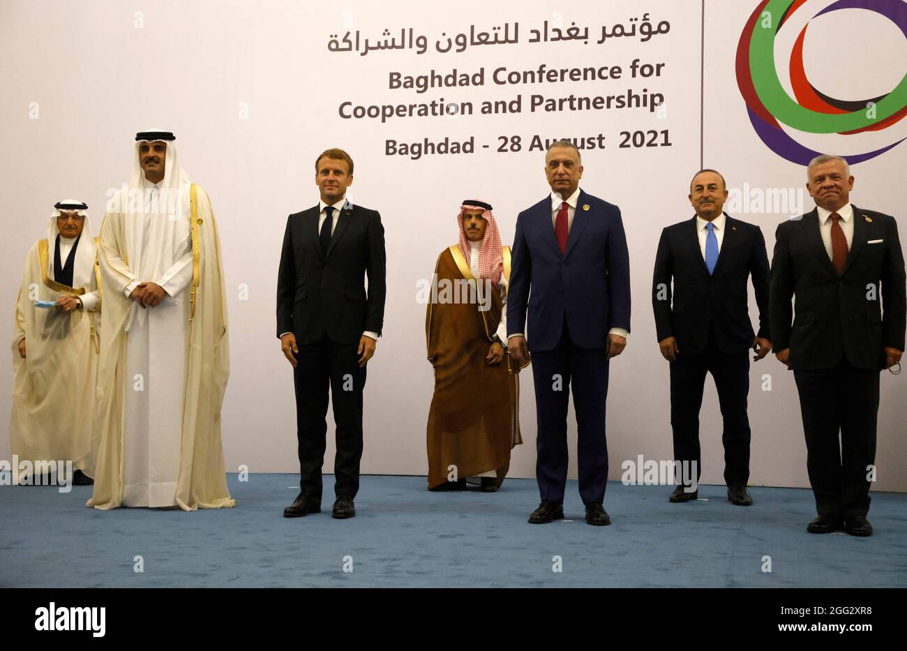 (L to R) Qatar’s Emir Sheikh Tamim al-Thani, French President Emmanuel Macron, Saudi Foreign Minister Faisal bin Farhan, Iraq's Prime Minister Mustafa al-Kadhemi, Turkey's Foreign Minister Mevlut Cavusoglu, and Jordan's King Abdullah II pose for a group picture after the meeting in Baghdad on August 28, 2021. (Photo by Ludovic MARIN / POOL / ABACAPRESS.COM Stock Photo