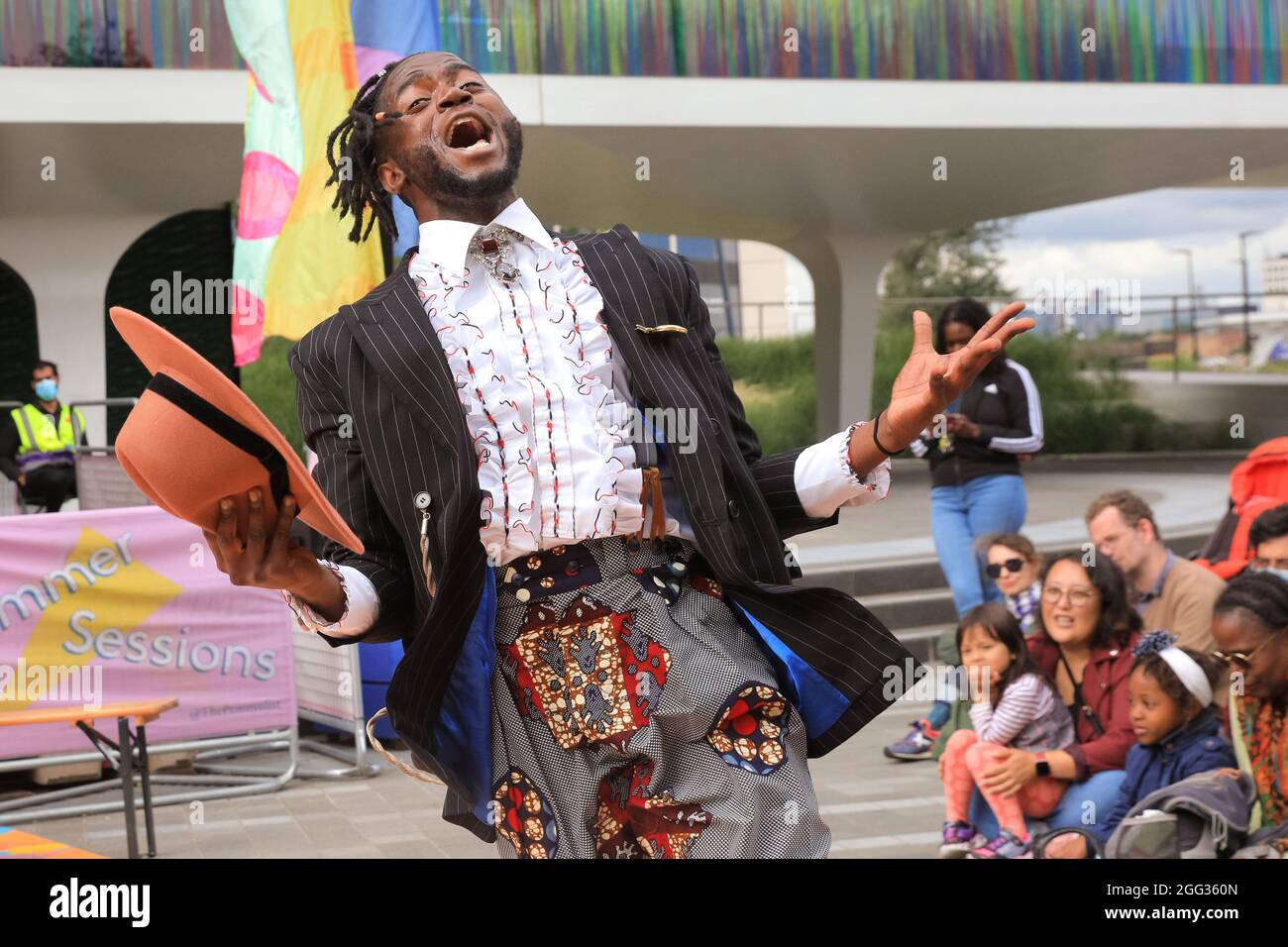 London, UK, 28th Aug 2021. Energetic performers present 'Dandyism' in flamboyant outfits as part of Patrick Ziza's flamboyant celebration of African style. The performance is one of the 'Dance by Design' series at Greenwich Peninsula, all part of Greenwich and Docklands International Festival 2021. Credit: Imageplotter/Alamy Live News Stock Photo