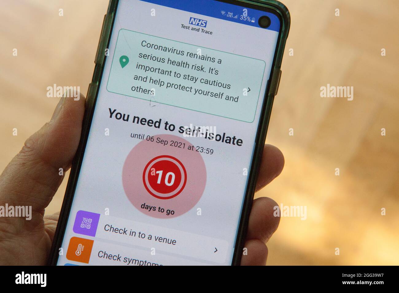 London, UK, 28 August 2021: With over 230,000 people per week testing positive for coronavirus in the UK, and on average over 100 people per day dying, this NHS Covid app notification to self-isolate for 10 days is a common sight. People who have received two vaccine doses are no longer required to self-isolate. Anna Watson/Alamy Live News Stock Photo