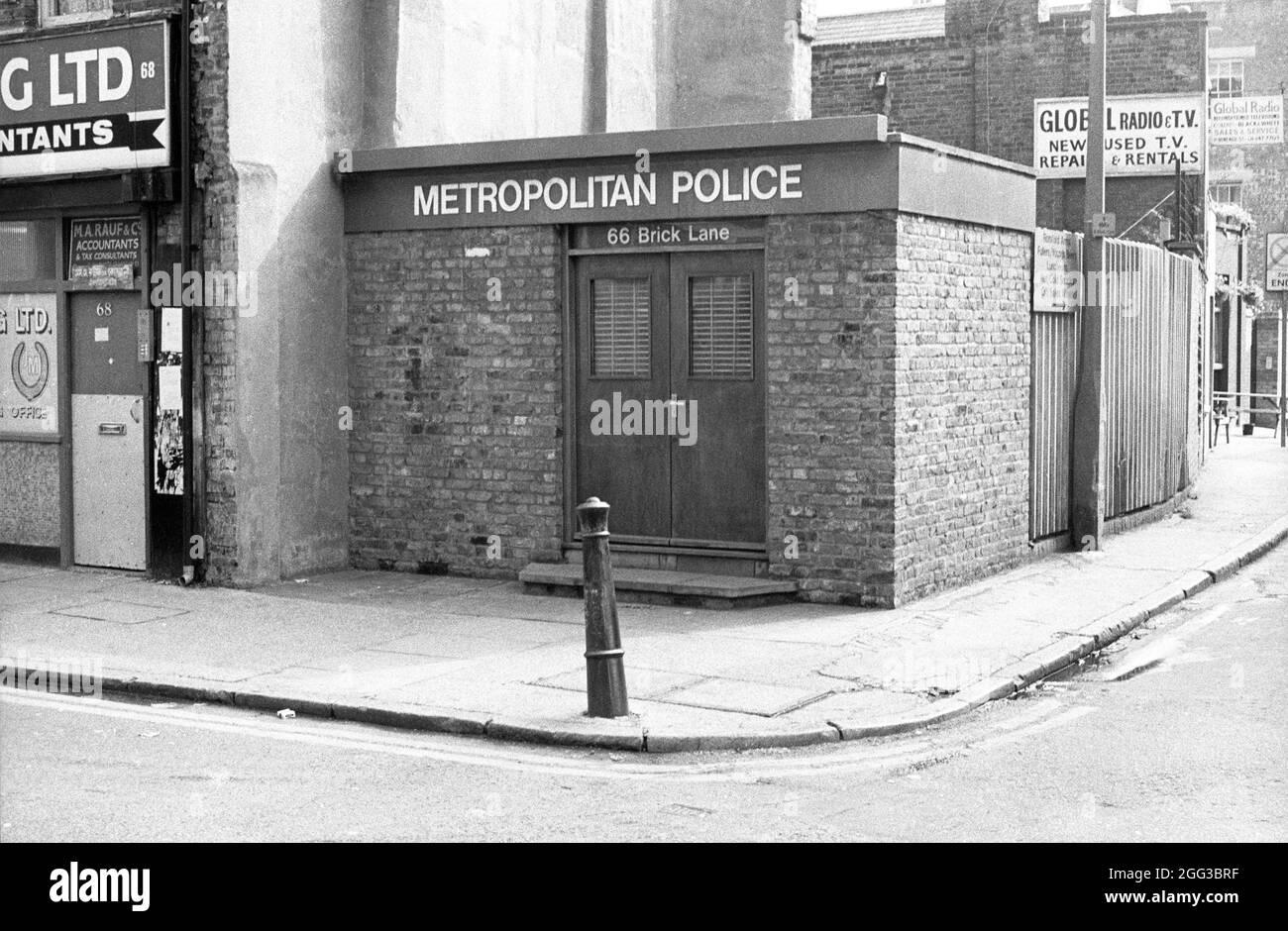 Now demolished Metropolitan Police Building at 66 Brick Lane, at the junction with Heneage Street, London, UK. Taken in July 1984. Stock Photo