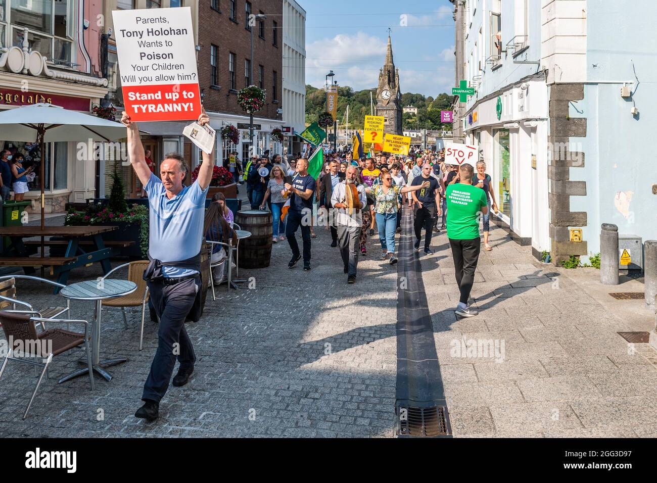 Waterford, Ireland. 28th Aug, 2021. Around 200 people gathered this afternoon in Waterford city centre to protest against the COVID-19 vaccines, which they say are experimental and still on trial. The protestors gathered at the clock tower on Meagher's Quay and marched through the city centre. Credit: AG News/Alamy Live News Stock Photo