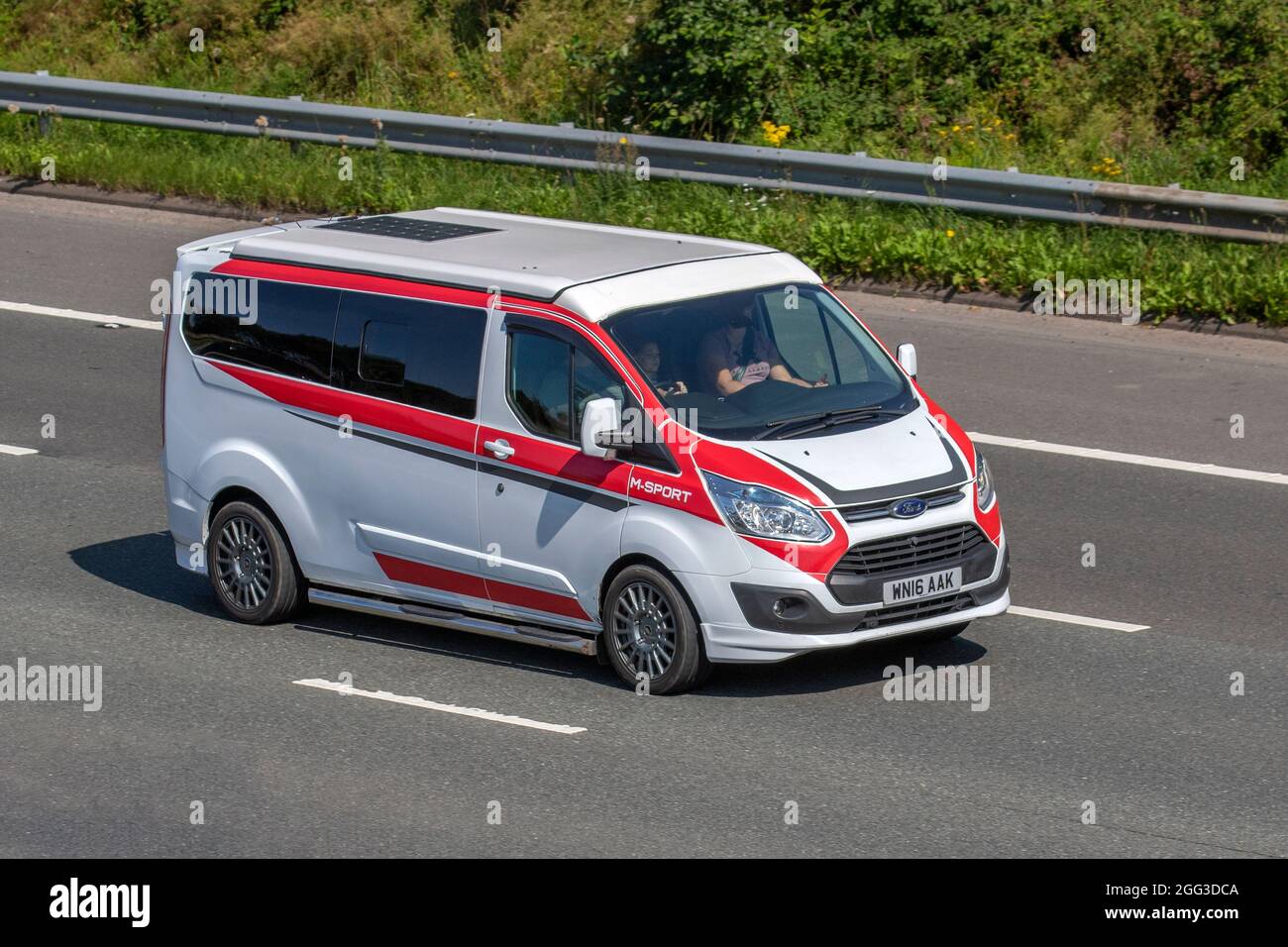 2016 red white Ford Transit van, 6 speed manual 2198cc vans, Vehicle  travelling on the M61 motorway, UK Stock Photo - Alamy