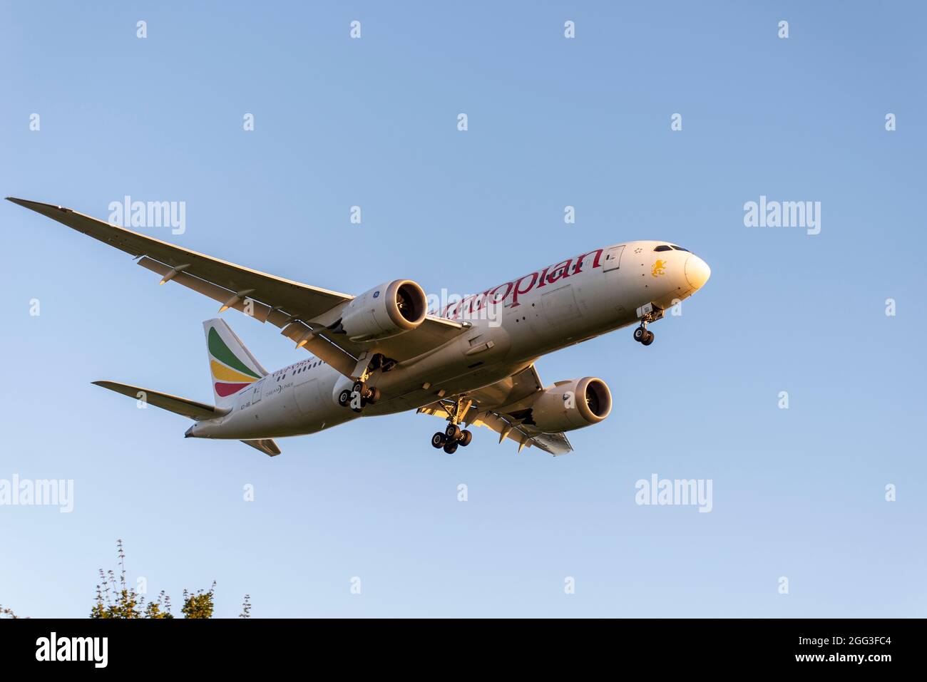 Ethiopian Airlines Boeing 787 Dreamliner airliner jet plane ET-ASI landing at London Heathrow Airport, UK early in the morning in blue sky Stock Photo